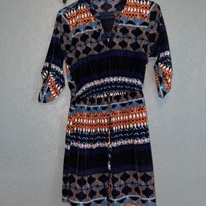 Women’s midi dress. 3/4 sleeve with button accent.